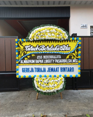 Papan Bunga Duka di Pidada